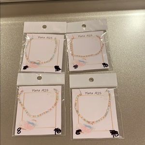 New silver bracelets with beads.